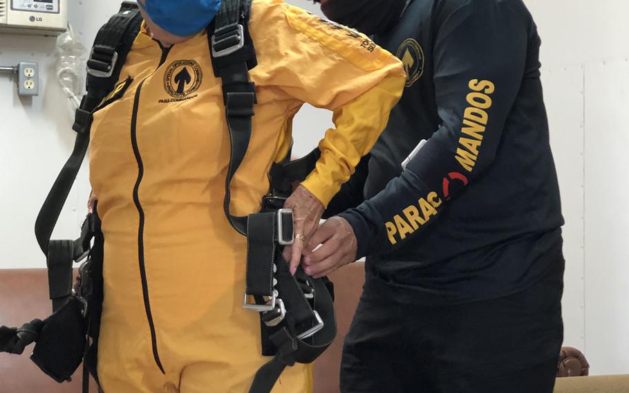 Sandee Rouse, Gold Star mother, and Army Sgt. Maj. Jose Vazquez, Special Operations Command Para-Commando, connect a tandem harness before a skydive March 13, 2021. Rouse’s son, Army Pfc. Jim Markwell, a medic with the 1st Battalion, 75th Ranger Regiment, died Dec. 20, 1989 during Operation Just Cause in Panama. 

