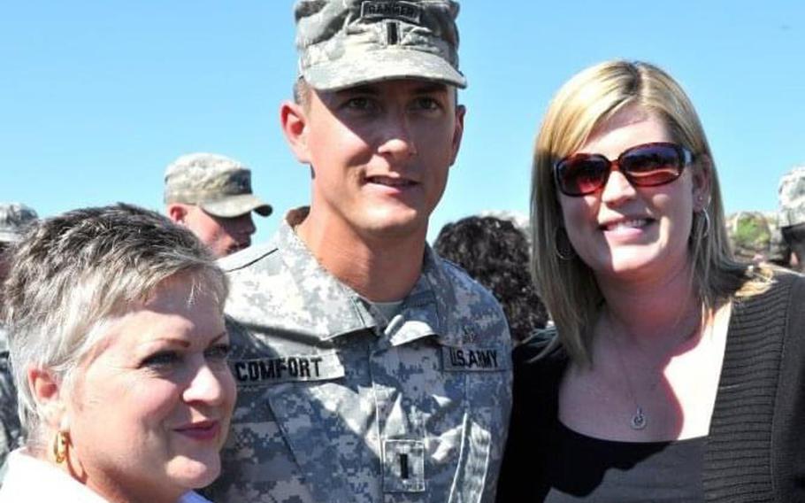 Ellen Comfort, her son Army 1st Lt. Kyle Comfort, and his wife, Brooke Comfort, enjoy time together after his graduation from Airborne school in March 2010. He deployed to Afghanistan the following week and was killed in action May 8, 2010. 

