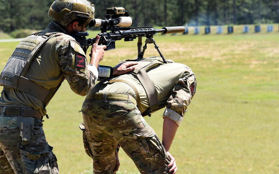 Competitors in the Best Sniper competition at Fort Benning in Georgia use their partners as a base for shooting during the four-day contest the began Monday, April 12. The contest tests snipers from the Army, Marine Corps and Coast Guard on their skills and adaptability to crown the best sniper duo in the U.S. military. 