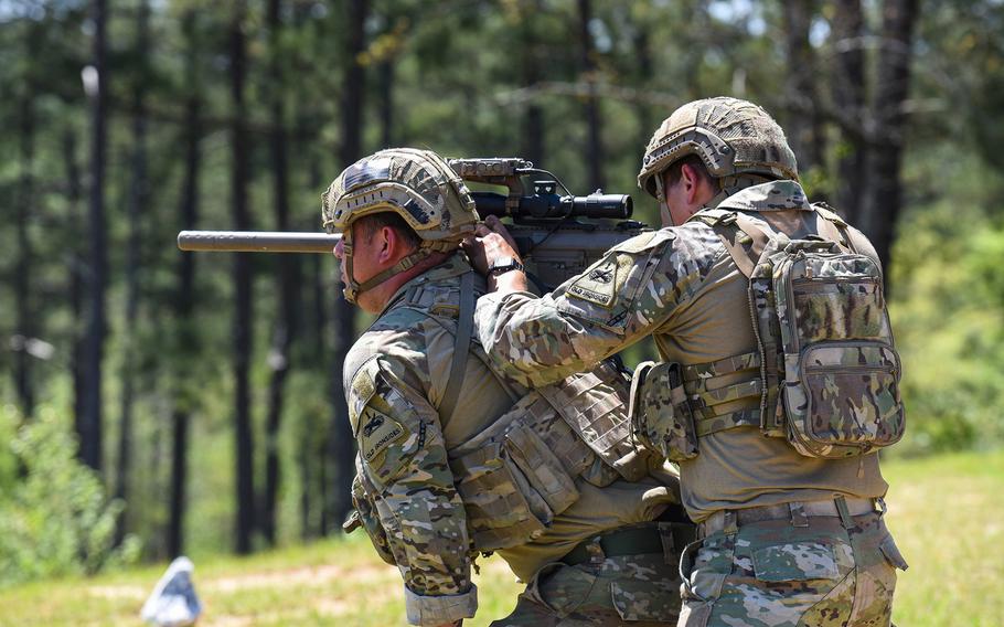 Competitors in the Best Sniper competition at Fort Benning in Georgia use their partners as a base for shooting during the four-day contest the began Monday, April 12, 2021. The contest tests snipers from the Army, Marine Corps and Coast Guard on their skills and adaptability to crown the best sniper duo in the U.S. military.
