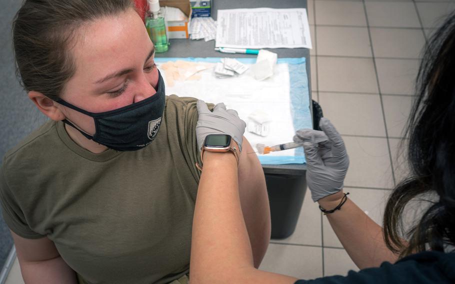 Army Spc. Alyssa Lore, a UH-60 Black Hawk crew chief with the 12th Combat Aviation Brigade, receives her second COVID-19 vaccine dose in February 2021 in Wiesbaden, Germany. More doses should arrive soon following a slow start to the Europe vaccination campaign, U.S. European Command's Gen. Tod Wolters told Congress on April 15, 2021.   

