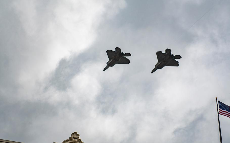 Two F-22 Raptors roar overhead after the U.S. flag was raised for the first time at the new World War I Memorial in Washington, D.C.,  on Friday, April 16, 2021, during a a dedication ceremony.