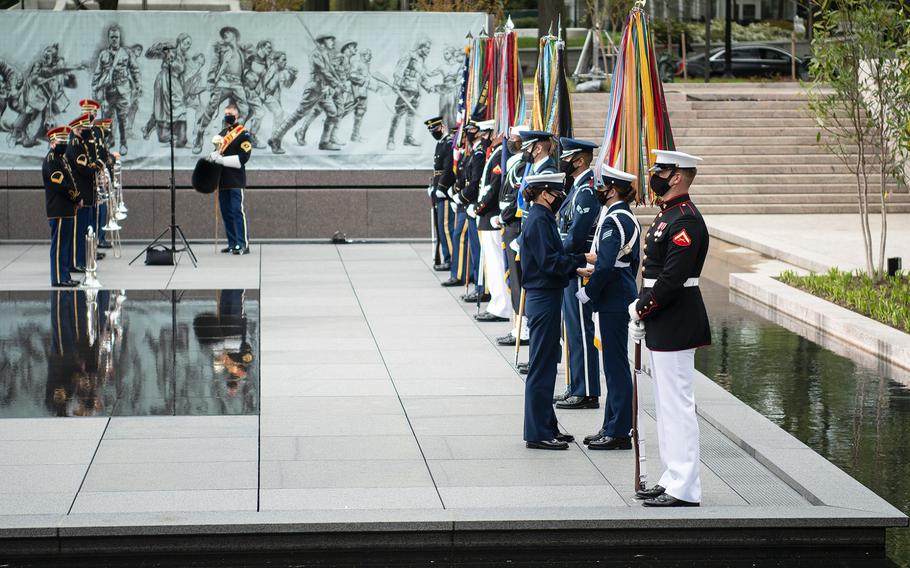 An honor guard member has her uniform adjusted just prior to the start of a dedication ceremony for the new World War I Memorial  in Washington, D.C., on Friday, April 16, 2021.