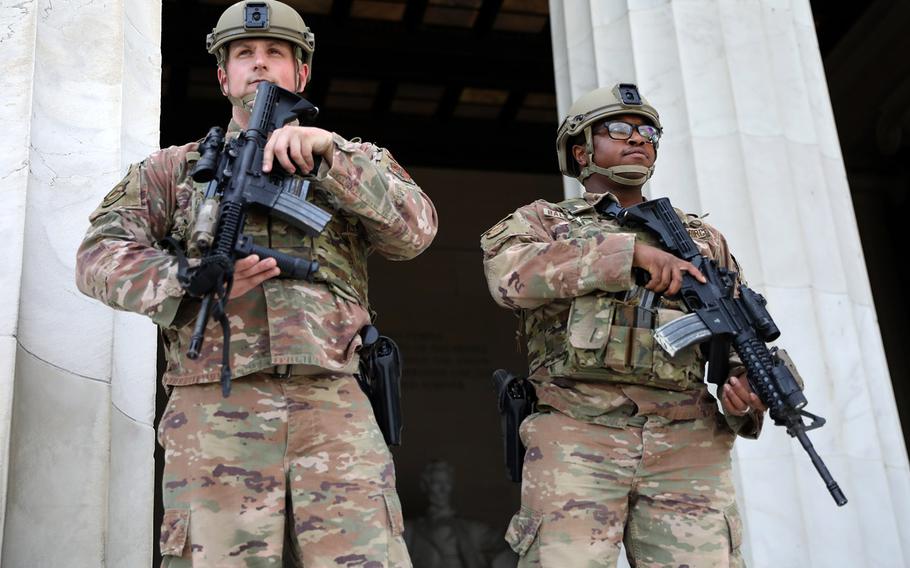 In a June 2, 2020 photo, District of Columbia National Guard airmen stand guard at the Lincoln Memorial after being deployed in response to protests and riots after the death of George Floyd.