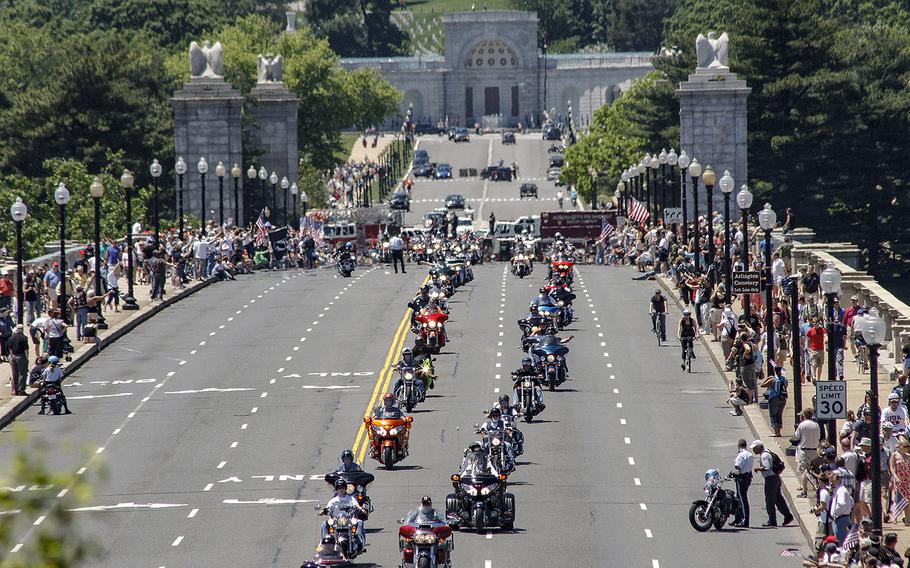 In a 2008 photo, crowds line the bridge at Arlington National Cemetery as Rolling Thunder riders cross into Washington, D.C.