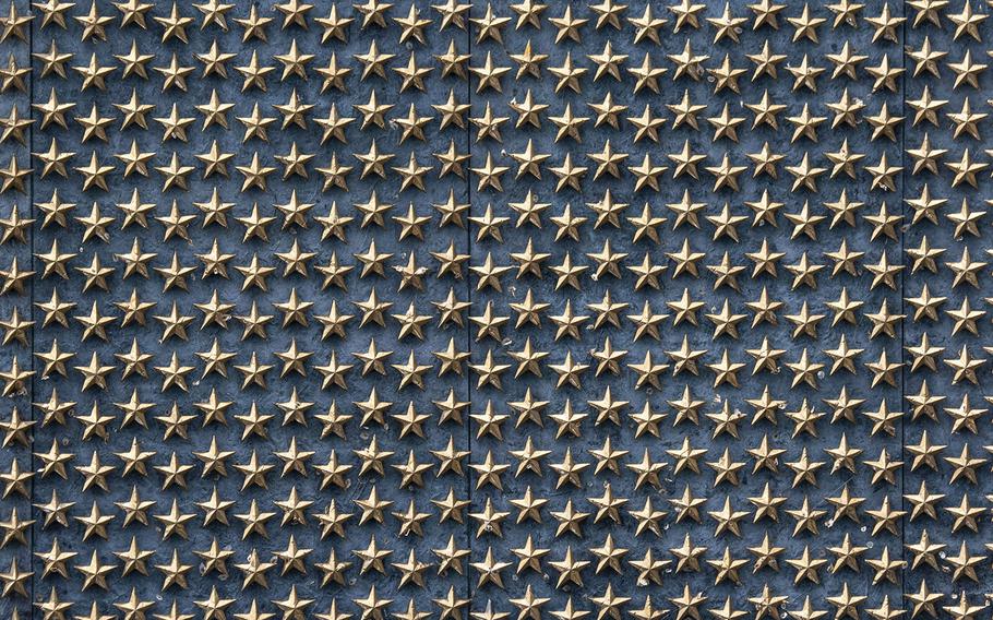 Some of the 4,048 gold stars on a wall at the National World War II Memorial in Washington, D.C., each representing 100 American service members who died during that conflict.