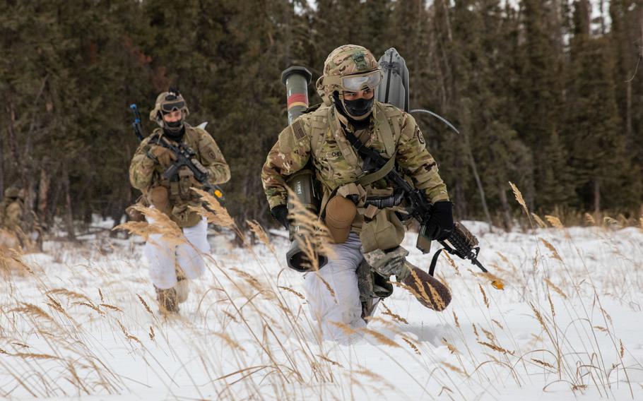 Paratroopers with 4th Infantry Brigade Combat Team (Airborne), 25th Infantry Division, cross a danger area during an assault exercise at Donnelley Training Area, Alaska, Feb. 11, 2021. Army scientists are looking into several methods for enhancing the ''thermal toughness'' of soldiers and making sure they don’t succumb to frostbite and hypothermia.

