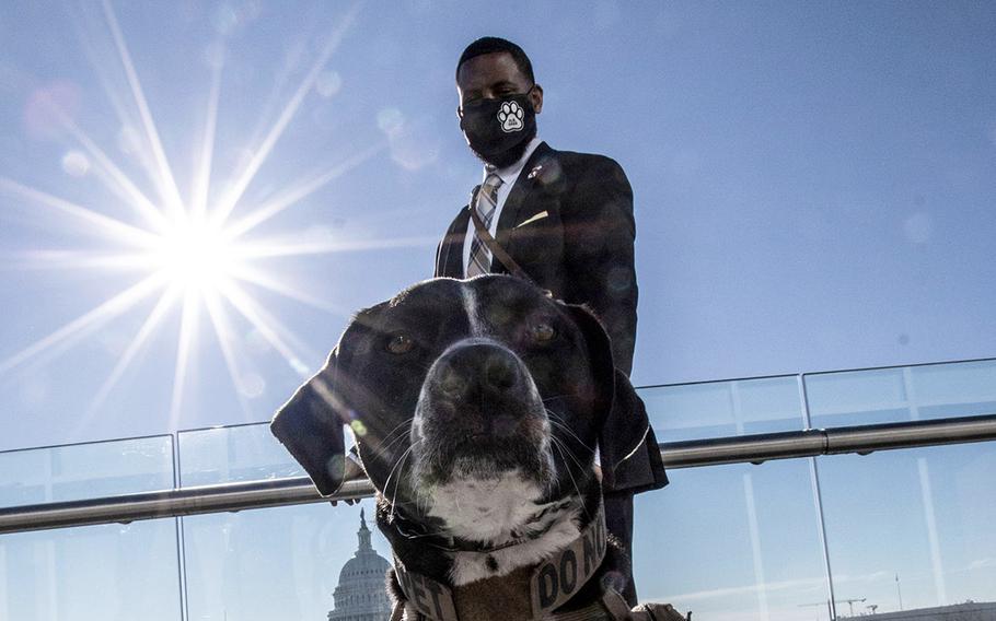 Veteran David Crenshaw and his service dog Doc at a Capitol Hill news conference to promote House bill, H.R. 1022, the Puppies Assisting Wounded Servicemembers Act, or PAWS Act, on March 3, 2021.