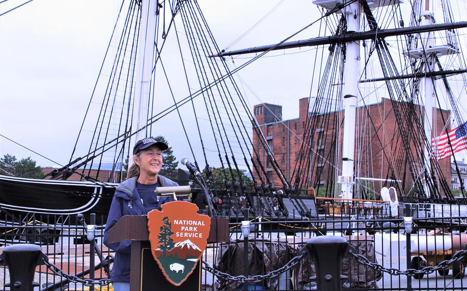 Dr. Lesa Staubus, a staff veterinarian with the American Humane, speaks during a brief canine adoption ceremony for U.S. Marine veteran Brendan Cabey and his former military working dog Ramos in front of the USS Constitution in Boston, on Sept. 11, 2020.