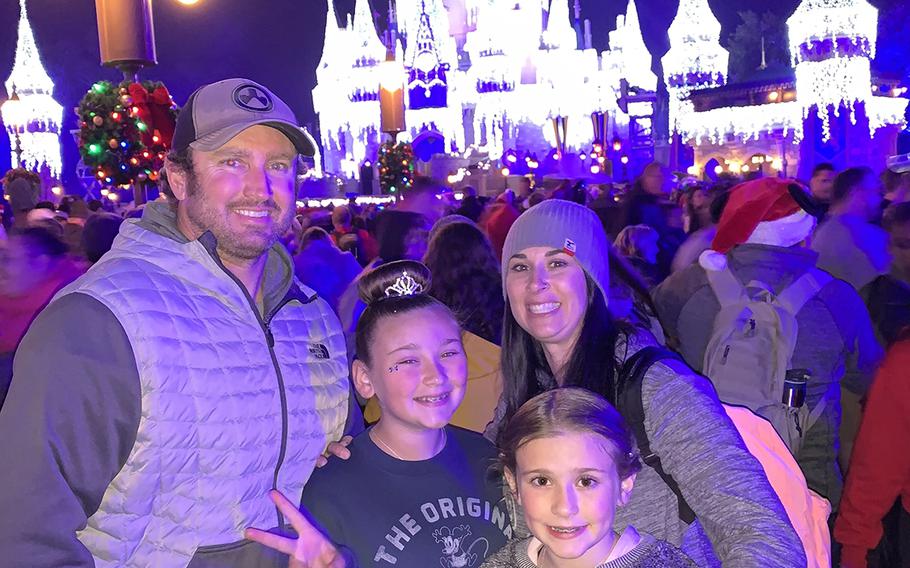 Green Beret Sgt. 1st Class Rich Stayskal poses with his daughter Addysin, 11, wife Meg and daughter Carly, 10, on a trip to Disney World in Nov. 2018 during a break in treatments. Stayskal is battling  metastatic stage IV lung cancer after military doctors failed to diagnose him for months in 2017. 