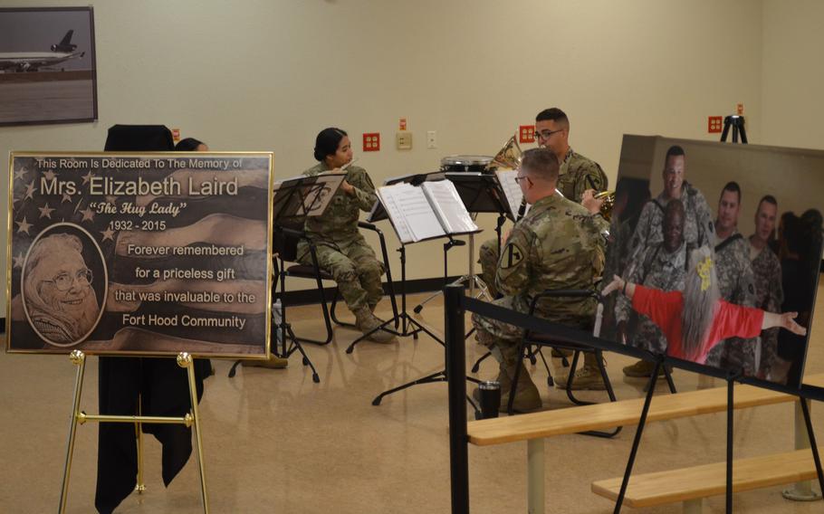 An element of the 1st Cavalry Division Band plays during a ceremony to honor Elizabeth Laird, the "Hug Lady," on July 1, 2019 at Robert Gray Army Airfield at Fort Hood, Texas. A plaque to honor Laird, who died in 2015, was unveiled in the room where she spent 12 years hugging soldiers as they deployed from and returned to Fort Hood.