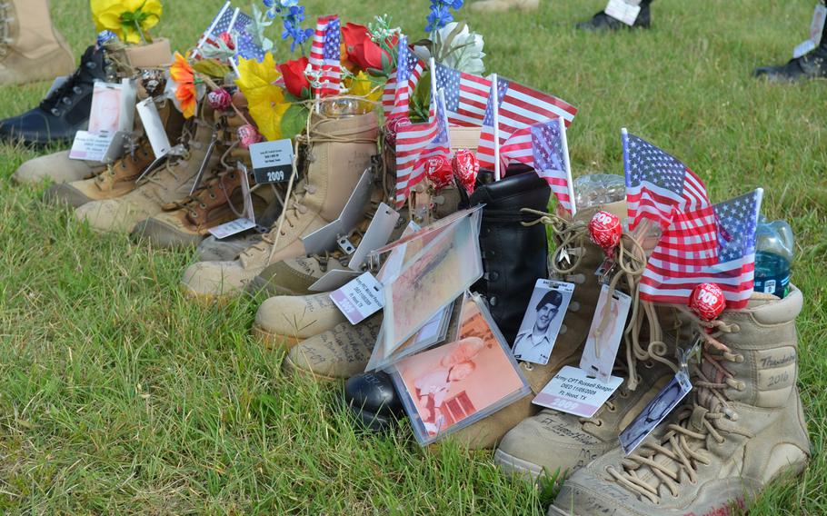 Visitors to the boot memorial, which is presented annually at Fort Hood, Texas, often tie together the boots of battle buddies or troops who died in the same action. The boots representing the 13 people killed during a mass shooting at Fort Hood on Nov. 5, 2009 are tied together and have been adorned with Tootsie Roll Pops.