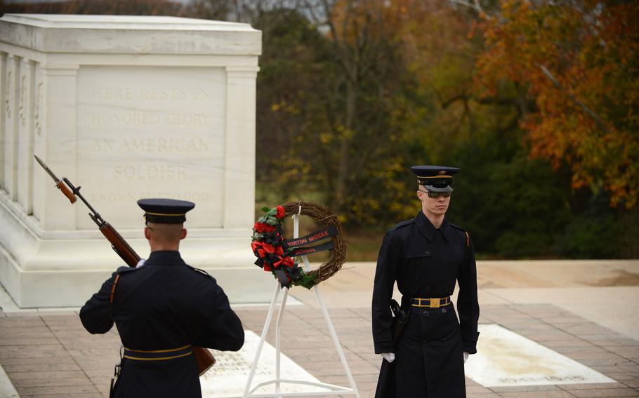 Honor guards patrol the Tomb of the Unknowns at Arlington National Cemetery in Arlington, Va., in 2018. 