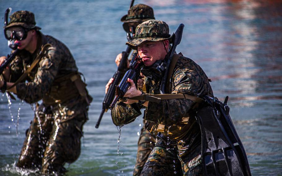 U.S. Marines with 1st Battalion, 3rd Marine Regiment, hit the shore during an amphibious assault exercise on Marine Corps Base Hawaii, April 28, 2020.