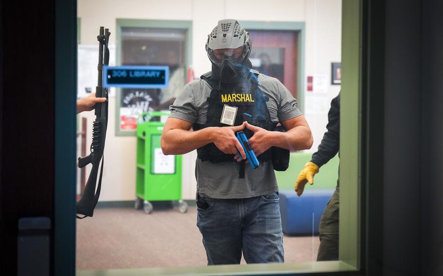 A Texas school marshal participates in an active-shooter training demonstration conducted at Walsh Middle School in Round Rock, Texas. The event by the Texas Commission on Law Enforcement demonstrated training to handle active shooter situations. The school marshal program allows school staff to carry a firearm on campus. 