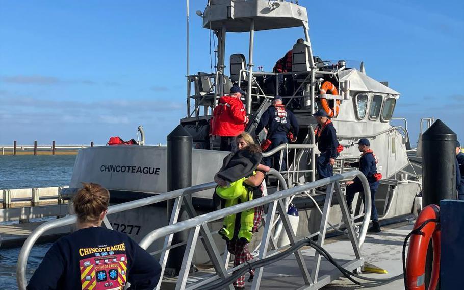 A Coast Guard Station Chincoteague 47-foot Motor Life Boat crew safely transfers 12 people ashore at the station on Friday, Oct. 28, 2022 in Chincoteague, Va.