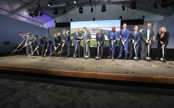 FILE - Chung Eui-sun, center left, executive chairman of Hyundai Motor Group, shakes hands with Georgia Gob. Brian Kemp as dignitaries join in for the official groundbreaking ing for the Hyundai Meta Plant, Oct. 25, 2022, in Ellabell, Ga. Hyundai and LG Energy Systems say they will build a $4.3 billion electric battery plant in Georgia. The factory would be on the site of the new electric vehicle assembly plant that Hyundai Motor Group is building near Savannah. The companies will split the investment, starting production as early as late 2025. 