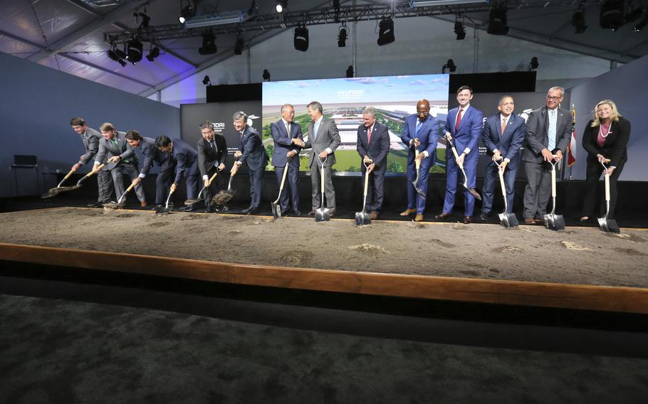 FILE - Chung Eui-sun, center left, executive chairman of Hyundai Motor Group, shakes hands with Georgia Gob. Brian Kemp as dignitaries join in for the official groundbreaking ing for the Hyundai Meta Plant, Oct. 25, 2022, in Ellabell, Ga. Hyundai and LG Energy Systems say they will build a $4.3 billion electric battery plant in Georgia. The factory would be on the site of the new electric vehicle assembly plant that Hyundai Motor Group is building near Savannah. The companies will split the investment, starting production as early as late 2025. 