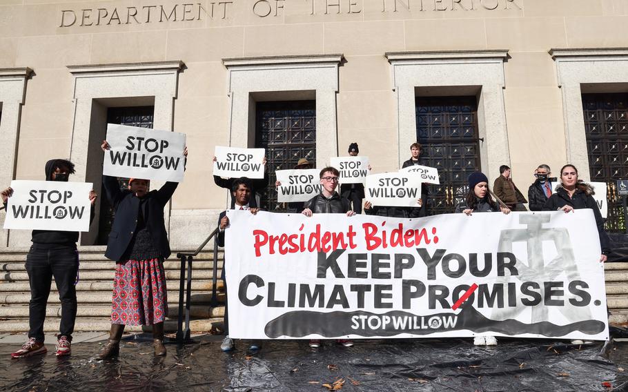 Climate activists hold a demonstration to urge President Joe Biden to reject the Willow Project at the US Department of Interior on Nov. 17, 2022, in Washington, D.C. 