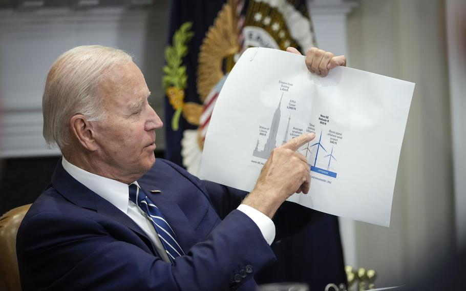 U.S. President Joe Biden points to a wind turbine size comparison chart during a meeting about the Federal-State Offshore Wind Implementation Partnership in the Roosevelt Room of the White House, June 23, 2022, in Washington, D.C. The White House is partnering with 11 East coast governors to launch a new Federal-State Offshore Wind Implementation Partnership to boost the offshore wind industry.