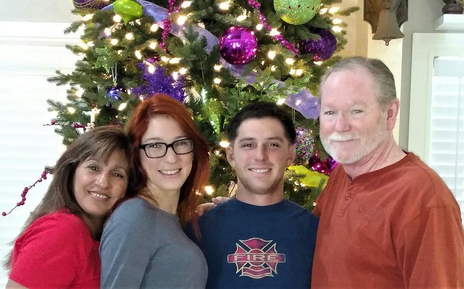This 2015 image provided by the Reed family shows Trevor Reed, second from right, with his family from left, mother Paula Reed, sister Taylor Reed and father Joey Reed. Russia is holding Marine veteran Trevor Reed, who was sentenced to nine years on charges he assaulted a police officer. 