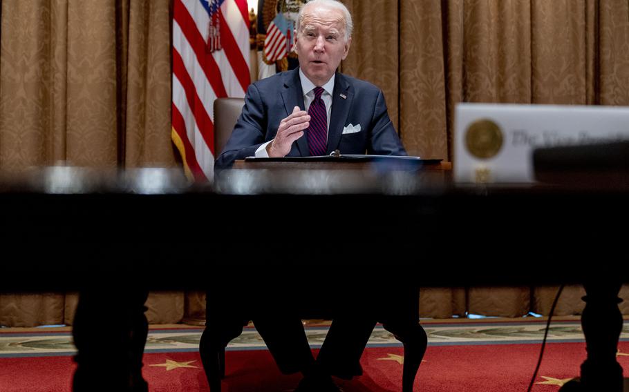 President Joe Biden meets with members of the Infrastructure Implementation Task Force to discuss the Bipartisan Infrastructure Law, in the Cabinet Room at the White House in Washington, Thursday, Jan. 20, 2022. 