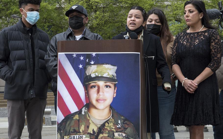 Backed by other family members and attorney Natalie Khawam, right, Spc. Vanessa Guillen's sister, Lupe, speaks at a news conference marking the first anniversary of the Fort Hood soldier's killing, April 22, 2021, at the Navy Memorial in Washington, D.C.