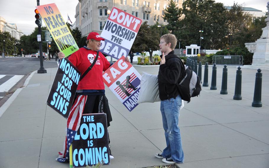 Members of the Westboro Baptist Church demonstrate outside the U.S. Supreme Court on Wednesday in advance of legal arguments related to their protest of a Marine's funeral in 2006.