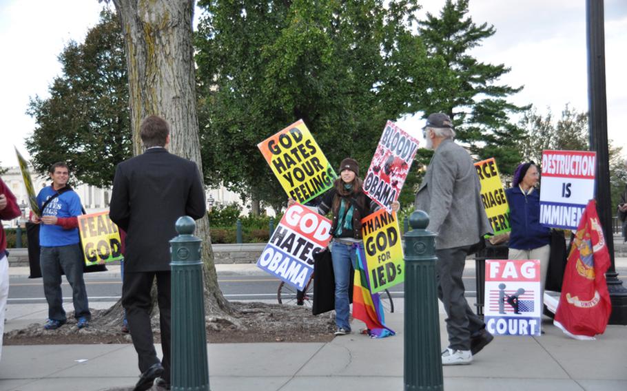 Members of the Westboro Baptist Church demonstrate outside the U.S. Supreme Court on Wednesday in advance of legal arguments related to their protest of a Marine's funeral in 2006.