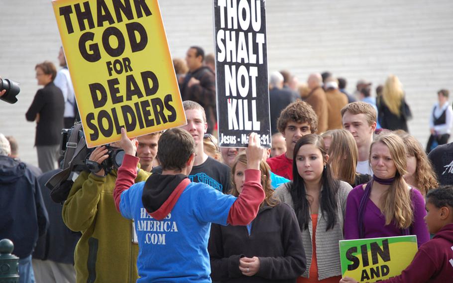A member of the Westboro Baptist Church protests outside the Supreme Court on Wednesday in Washington, D.C.