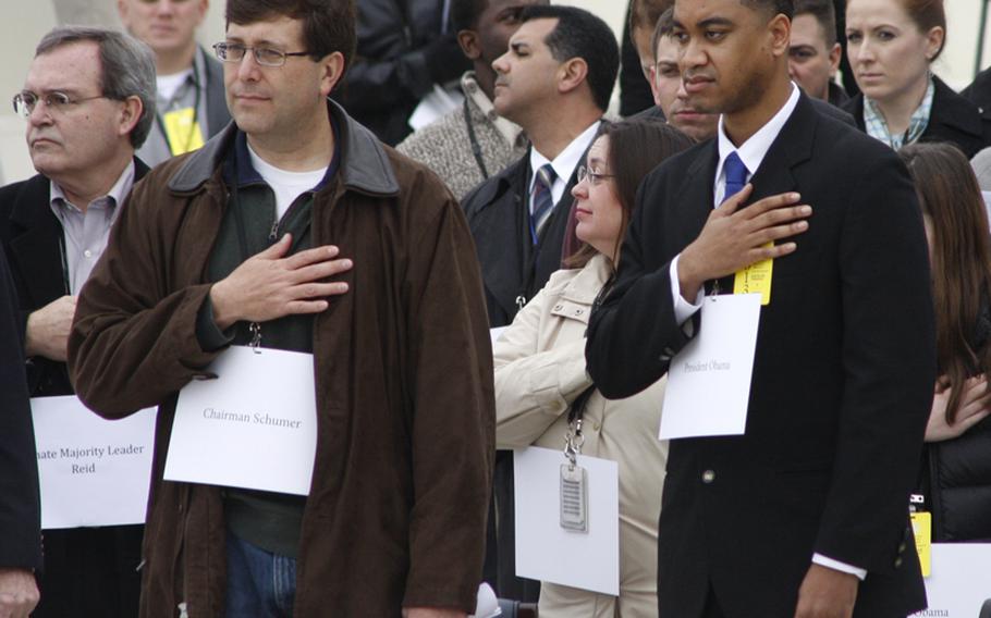 Air Force Staff Sgt. Serpico D. Elliott, right, and other stand-ins during Sunday's inauguration rehearsal.