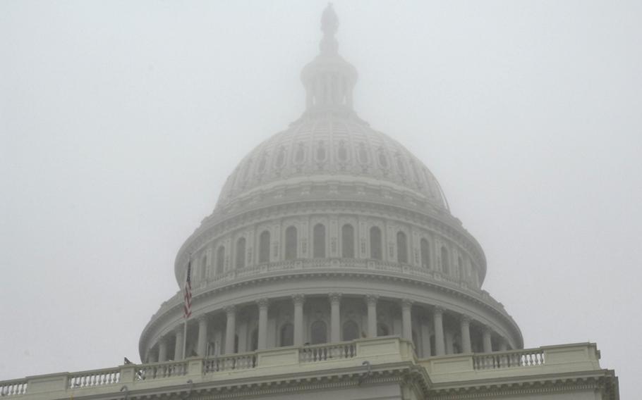 Fog descends on the Capitol dome during Sunday's inauguration rehearsal.