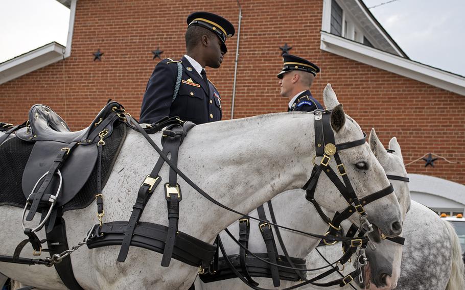 Two members of the Old Guard get ready to head to Arlington National Cemetery. 