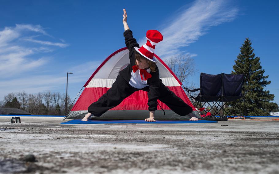 Principal Dianne Coplin performs yoga as she works from atop the school dressed as the Cat in the Hat on April 14, 2015, at Colonel Donald McMonagle Elementary in Mt. Morris Township, Mich. Students at the school read 6,693 books, exceeding their reading month goal of 5,000, resulting in Coplin dressing as the famous Dr. Suess character. 