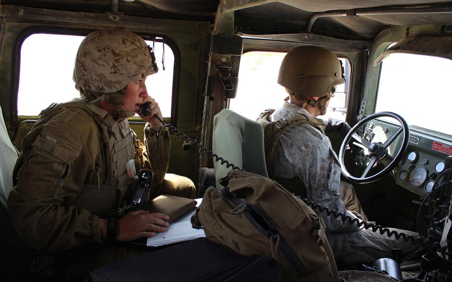 Capt. Megan Selbach-Allen, communications officer for 1st Tank Battalion, does a radio check during Exercise Desert Scimitar at Twentynine Palms, Calif., in April 2015. Selbach-Allen was 1 of the 1st women to be assigned to 3rd Combat Engineer Battalion and to 1st Tank Battalion but said her gender has been a nonissue in both units.