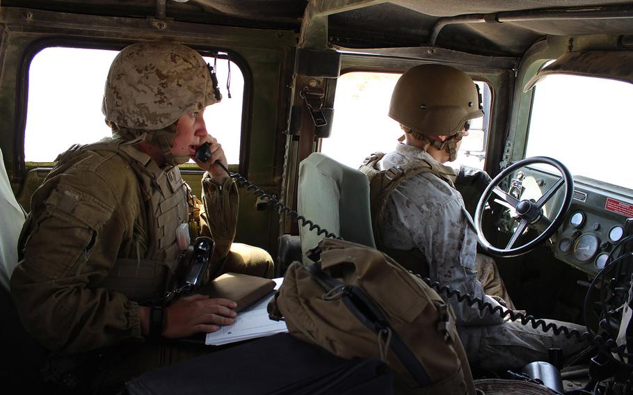 Capt. Megan Selbach-Allen, communications officer for 1st Tank Battalion, does a radio check