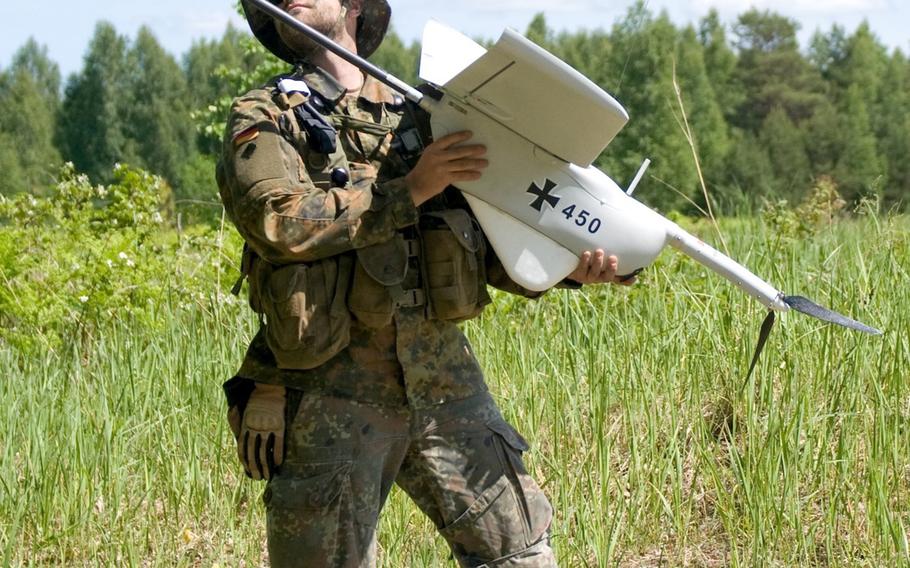 Staff Sgt. Dirk Maushake, a German army unmanned aerial vehicle operator prepares to launch a UAV Aladin during exercise Saber Strike, in Rukla, Lithuania June 10, 2015.