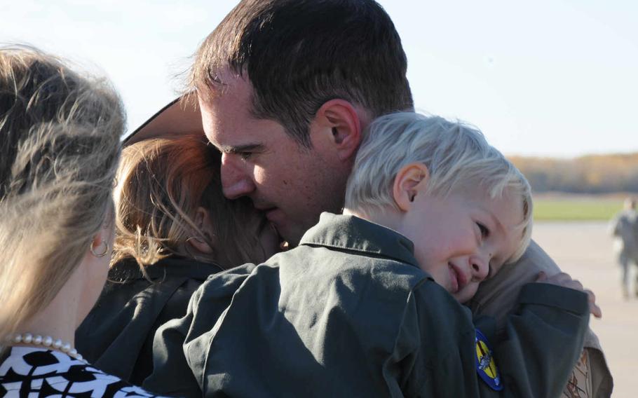 A pilot with the 127th Wing's 107th Fighter Squadron from Selfridge Air National Guard Base, Mich., reunited with his family on October 22, 2015, after a six-month deployment to the Middle East to fight the Islamic State group. About 500 airmen from the base were deployed throughout the summer, representing the largest and longest mass deployment from Selfridge since the Korean War.
