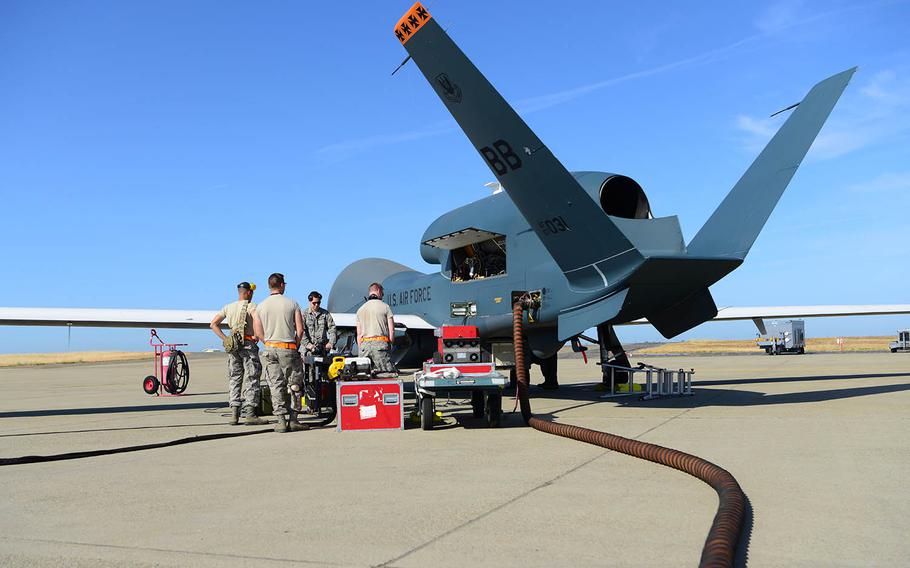 Airmen with 12th Aircraft Maintenance Unit RQ-4 Global Hawk prepare an RQ-4 for a flight at Beale Air Force Base, Calif., June 5, 2018.