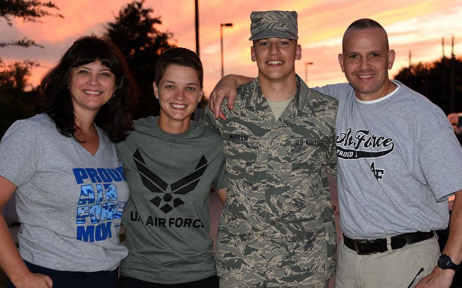 Johanna Gilbert, left to right, Marine Capt. Sarah Rhodes, Airman Maurice Murrain and Marine Maj. Lyle Gilbert pose after Murrain graduated from Air Force Basic Training in September.