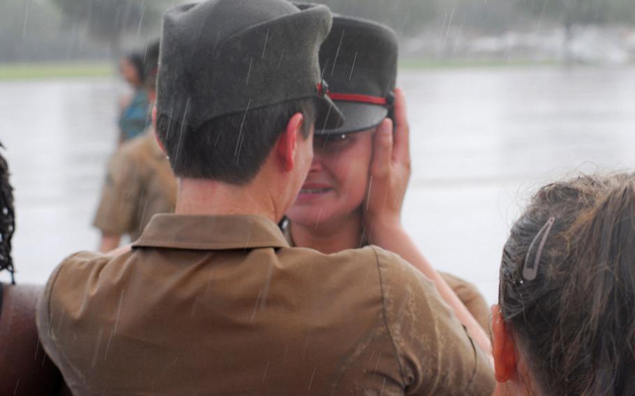 Now-Sgt. Jordan Gilbert, right, is congratulated by her older sister, now-Marine Capt. Sarah Rhodes, after completing Marine Corps recruit training in 2013.