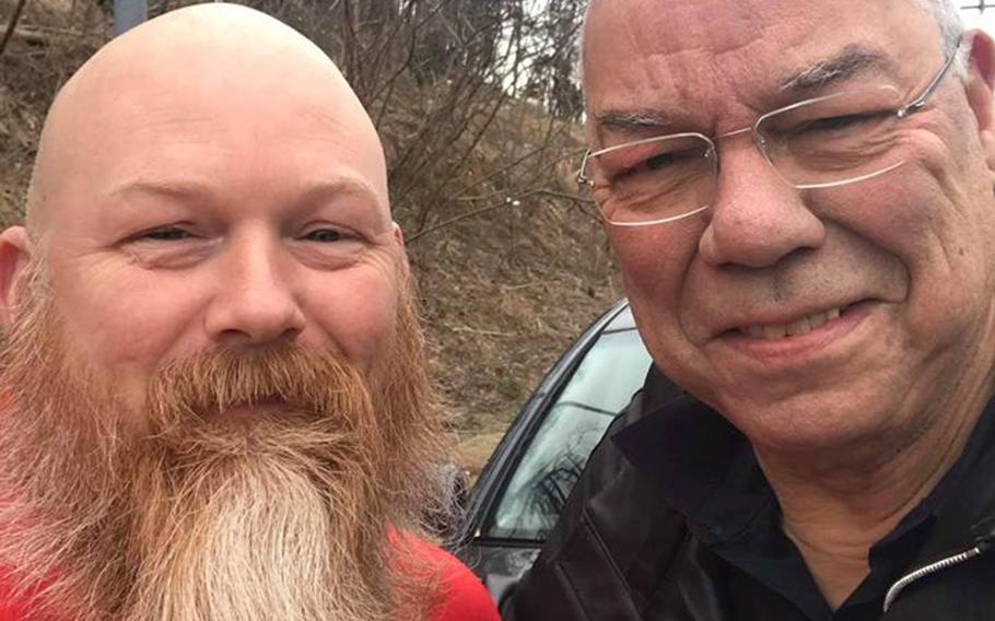 Former Secretary of State Colin Powell, right, poses with Anthony Maggert on the side of Interstate 495 near Walter Reed National Military Medical Center in Bethesda, Md., Wednesday, Jan. 23, 2019. The Good Samaritan stopped to help the retired four-star Army general change a flat tire.