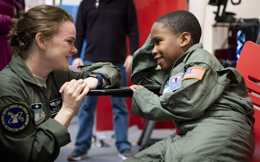 Air Force Academy cadet Julia Pack talks with Je'Moni Ford, a 9-year-old "Cadet for a Day" taking part in a joint program between the academy and the Make-A-Wish Foundation, on Friday, March 15, 2019. Je'Moni was diagnosed with a rare form of cancer in 2017 and endured six surgeries to remove the cancer and reconstruct his hand.