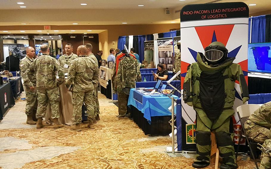 Visitors explore the exhibition hall at the Land Forces Pacific Symposium in Hawaii, Tuesday, May 21, 2019.