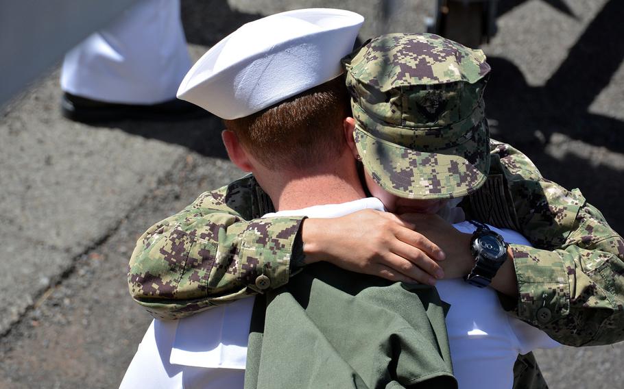 A sailor from the USS Chung-Hoon gets a long embrace minutes after his arrival at Joint Base Pearl Harbor-Hickam, Hawaii, May 31, 2019.