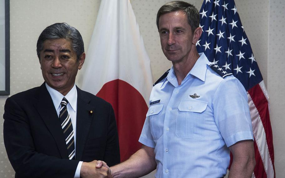 U.S. Forces Japan commander Lt. Gen. Kevin Schneider welcomes Defense Minister Takeshi Iwaya to Yokota Air Base, Japan, Wednesday, June 19, 2019.