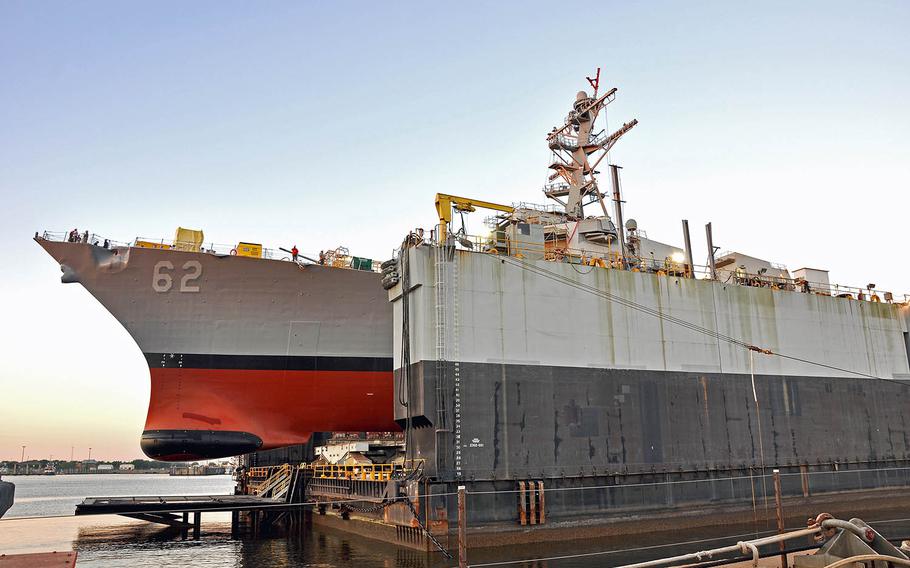 The guided-missile destroyer USS Fitzgerald sits inside a dry dock in preparation for launch at Pascagoula, Miss., April 16, 2019. Since the ship's arrival in Pascagoula in January 2018, work has focused on restoring the integrity of the hull and topside structures that were damaged during a collision in 2017 that claimed the lives of seven sailors.