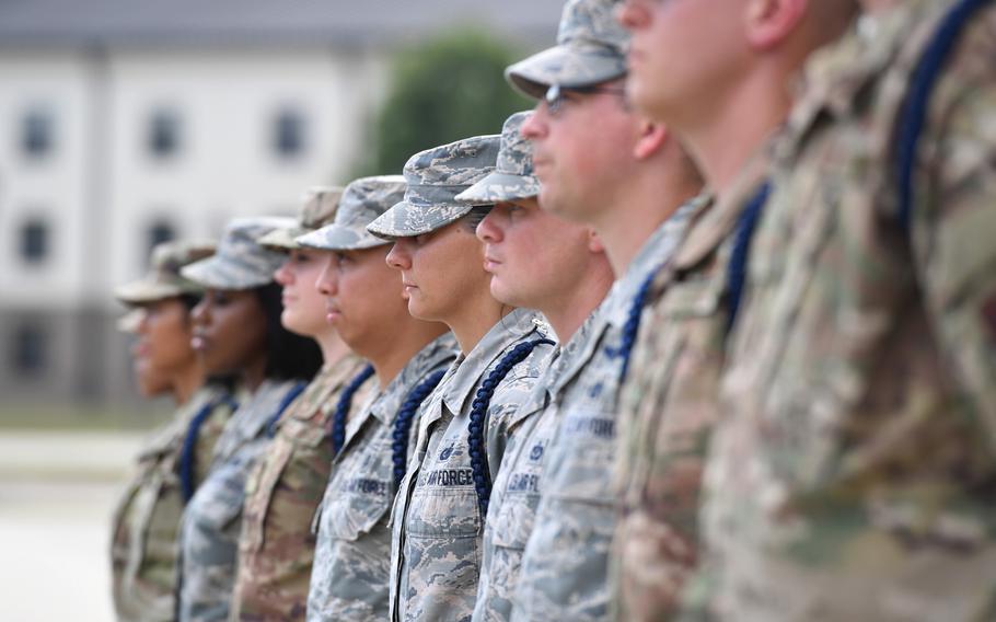 Airmen stand in formation during a Military Training Leader course graduation ceremony at the Levitow Training Support Facility on Keesler Air Force Base, Miss., May 30, 2019. The Air Force has shortened the length of tours for military training instructors from four years to three.