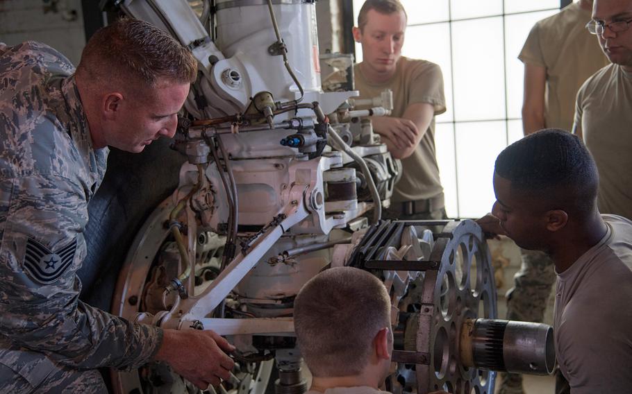 Tech. Sgt. Dylan Drake, left, a crew chief instructor with the 372nd Training Squadron Field Training Detachment 5, speaks to his students during a course at Barksdale Air Force Base, La., June 4, 2019. The Air Force has shortened the length of tours for military training instructors.