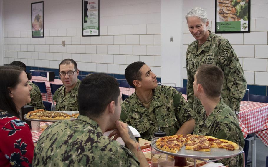Vice Adm. Mary Jackson, right, speaks with recruits during pizza night for graduating divisions at Recruit Training Command, Great Lakes, Ill., May 30, 2019. U.S. Special Operations Command has denied a recent report that said there were plans to ban foods like pizza and mandate a low-carbohydrate ketogenic diet for servicemembers.